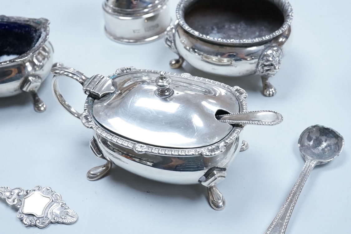 Two George VI silver three piece condiment sets by Walker & Hall, London, 1936/7, together with a modern silver mounted pepper mill by Mappin & Webb and two plated spoons.
